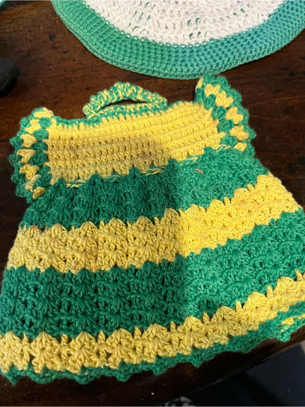 Handmade Green and Yellow Crochet Kitchen Dress Pot Holder and a clock crocheted